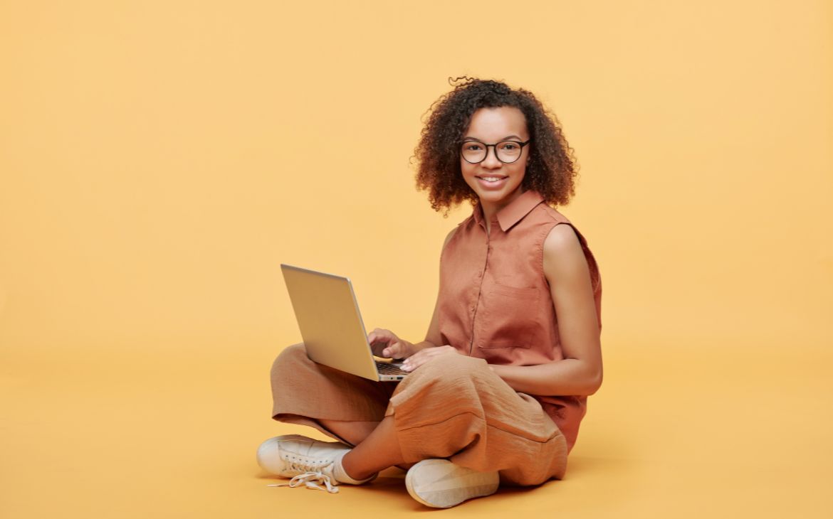 Afro-American girl using laptop
